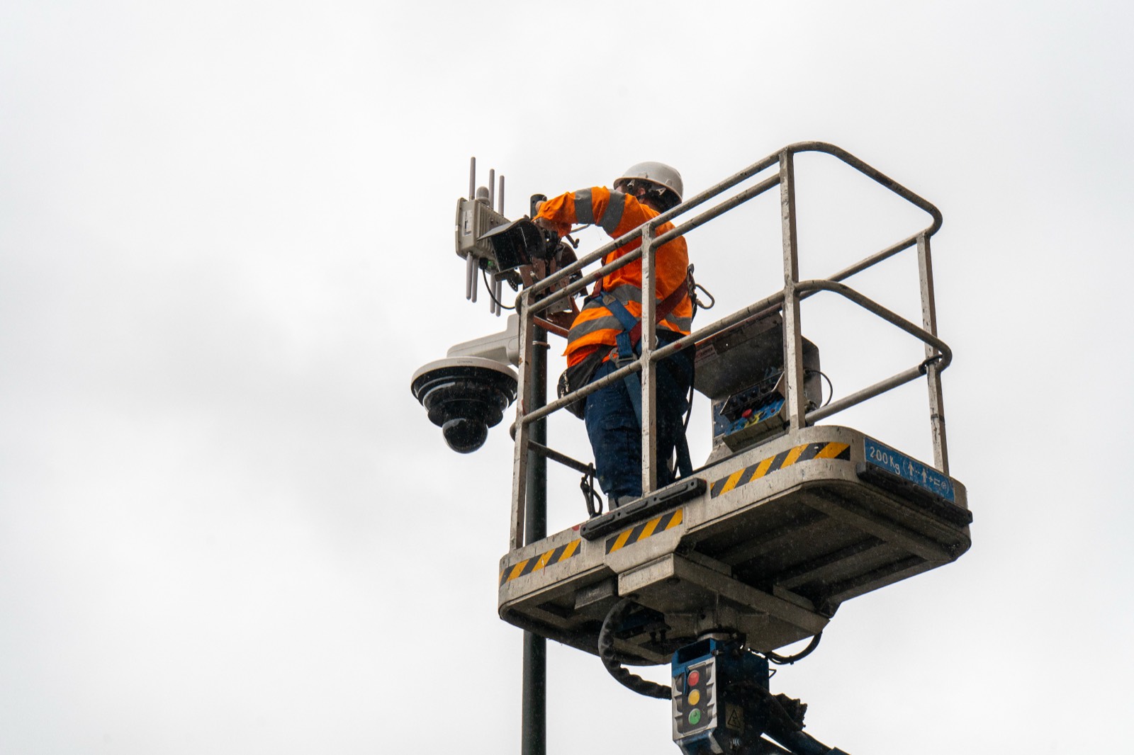Caboto field technician installing a LiDAR and edge AI sensing payload from a cherry-picker