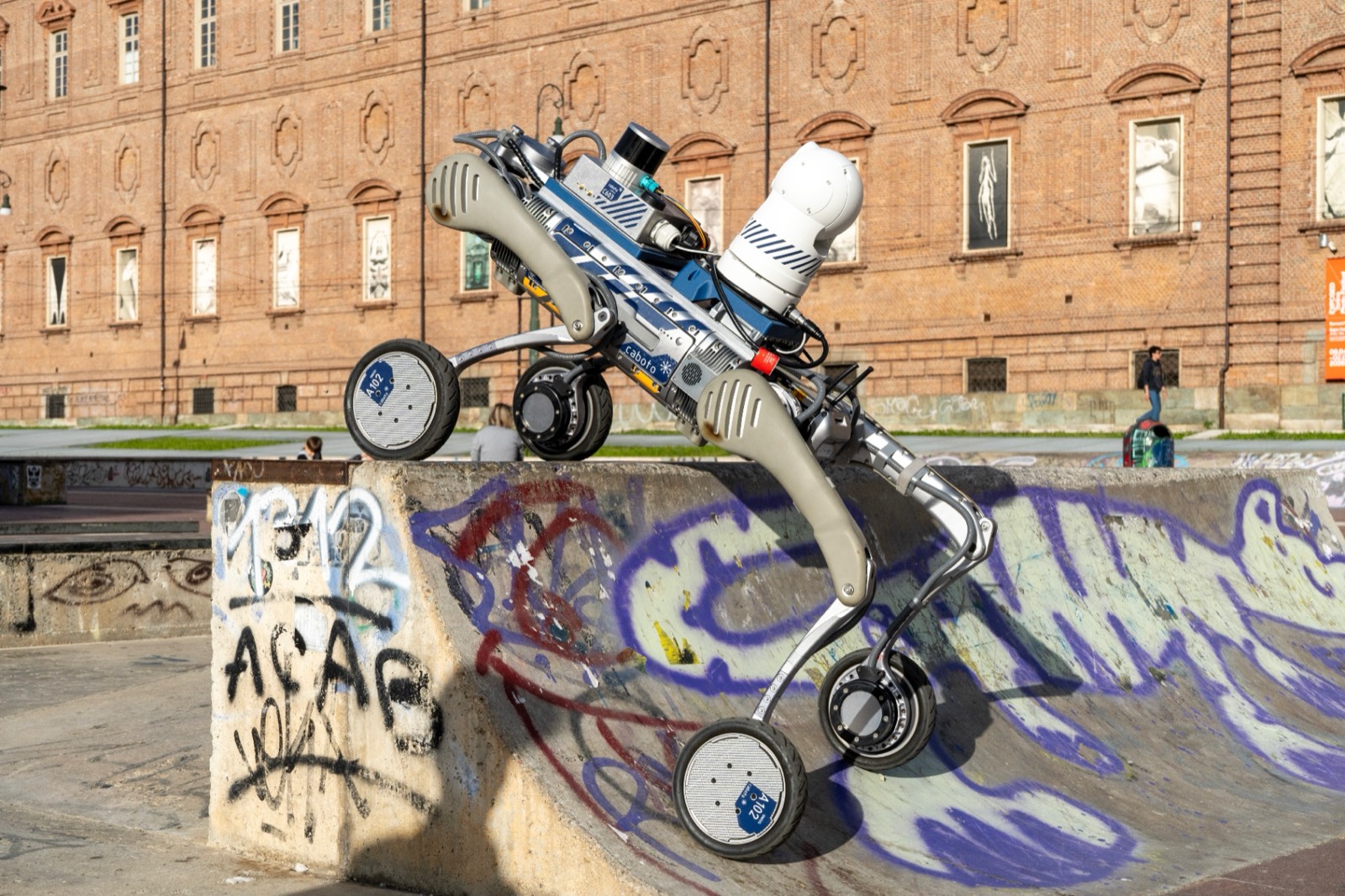 Caboto wheeled-legged robot navigating an urban public test environment